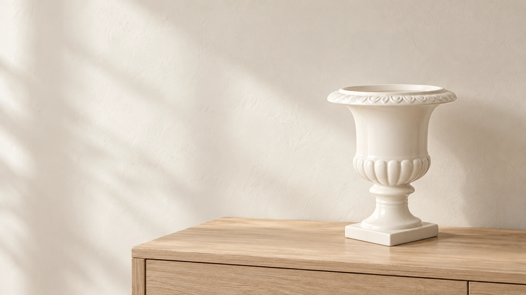 Classic White Ceramic Urn on a pale wood consoleslider_item_1